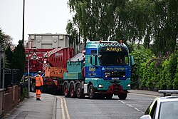 An Allelys Heavy Haulage truck carrying a transformer towards Dogger Bank Convertor Station sets off from Albert Dock in Kingston upon Hull along Manor House Street.