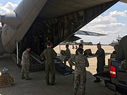 U.S. military relief crews load supplies aboard a C-130 Hercules from the Illinois Air National Guard's 182nd Airlift Wing based in Peoria. The C-130 and crew have been assisting with Hurricane Harvey relief efforts since 31 Aug.