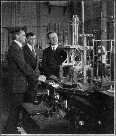 Langmuir (center) in 1922 in his lab at GE, showing radio pioneer Guglielmo Marconi (right) a new 20 kW triode tube