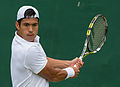 Jason Kubler competing in the first round of the 2015 Wimbledon Qualifying Tournament at the Bank of England Sports Grounds in Roehampton, England. The winners of three rounds of competition qualify for the main draw of Wimbledon the following week.