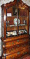 ;Rawlinson display cabinet 1772 The highly decorated cabinet featuring carving marquetry and gilding was commisssioned by the Quaker, Mary Hutton Rawlinson widow of Thomas Hutton Rawlinson, the ironmaster and West Indies merchant who traded from Lancaster. Thomas was a slave trader. It was executed by Thomas and John Dowbiggin, Thomas was the father of Francis Dowbiggin. Its significance is that it documented in the Gillow's Estimate Books in great detail.