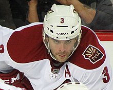 Keith Yandle, pictured with the Phoenix Coyotes in 2013, broke Jarvis' record in January 2022, and held it himself until October 2022. Keith Yandle (12183984203).jpg
