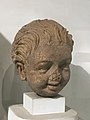 "Laughing boy", stucco from Gandhara, 2nd-3rd century CE