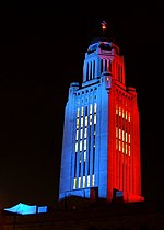Thumbnail for File:Nebraska State Capitol illuminated blue and red.jpg