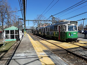 Outbound train at Waban station, March 2022.JPG