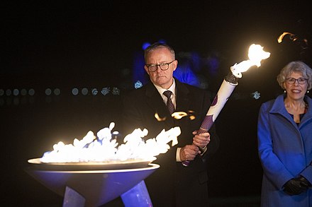 Prime Minister Anthony Albanese lighting the jubilee beacon in Canberra