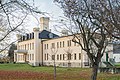 Castle, northern horse stable and pavement of the former farm yard of a manor as well as manor park and garden design elements of the landscape beautification in the area surrounding the location (avenues, groups of trees and solitary trees), individual monuments to ID no.  09306896