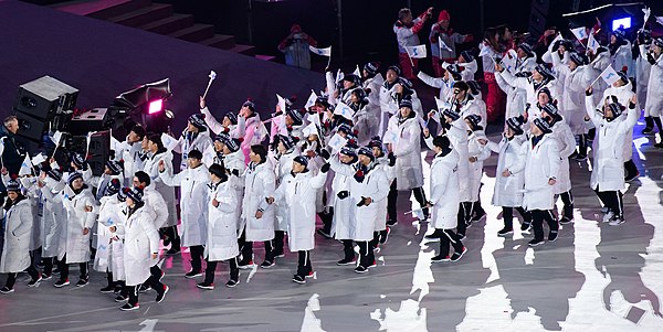 The delegations of North and South Korea march as one during the opening ceremony of the PyeongChang 2018 Winter Olympics, in which South Korea was th