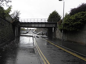 The underpass leading from the town centre (behind camera) to Obins Street (beyond the bridge). The area is known as "the Tunnel". Railway bridge at the Tunnel - geograph.org.uk - 1501924.jpg