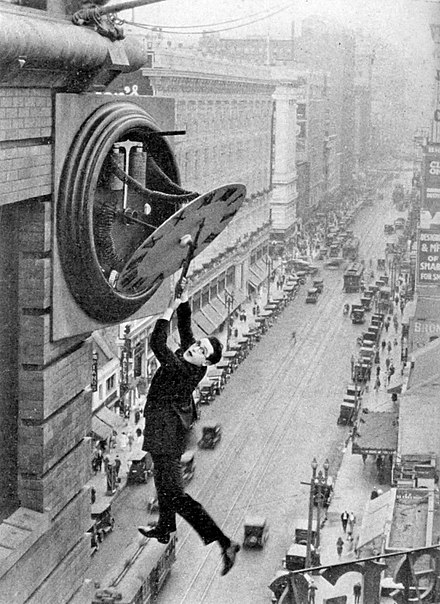 Harold Lloyd in 1923's Safety Last!, hanging (safely) from the clock tower. Lloyd may have been influenced by the real life stunts of Rodman Law a decade earlier.