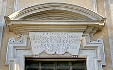 The plaque celebrating the foundation of the basilica, placed above the main door on St. Barnabas Square. San Barnaba Marino 2020 2.jpg