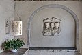 English: Roman stone relief with one woman and two men (CSIR II/2, 162) at the porch Deutsch: Nischenportraitgrabstein mit Büsten einer Frau und zweier Männer (CSIR II/2, 162), römischer Grabstein in der Turmvorhalle