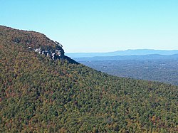 The Sauratown Mountains cut through Stokes County which is otherwise gently rolling piedmont hills. The Blue Ridge Mountains in the background lie to the west of Stokes County.