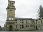 Shaw Lodge Mill weaving sheds and clock tower