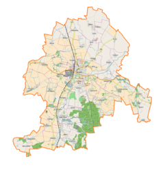 Mapa konturowa gminy Strzelin, w centrum znajduje się punkt z opisem „Parafia Matki Chrystusa i św. Jana Apostoła i Ewangelisty”
