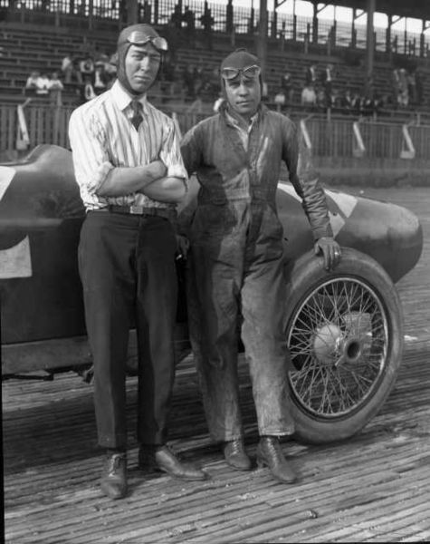 1922 Indianapolis 500 winner Jimmy Murphy (left) is shown here with his riding "mechanician" Eddie Olson, posing next to their Duesenberg at Tacoma Sp