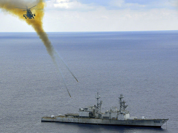 A Mexican helicopter firing rockets at the former USS Conolly, an obsolete Spruance-class destroyer, during  UNITAS Gold in 2009