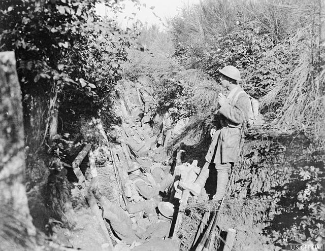 Men of Company I, 308th Infantry, resting after capturing German second line trenches 1½ miles north of Le Four de Paris; Lieutenant Stewart in charge