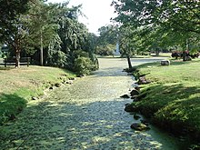 Toney's Brook with the pond and memorial in the background Toneys Brook, Edgemont Memorial Park (2006).jpg