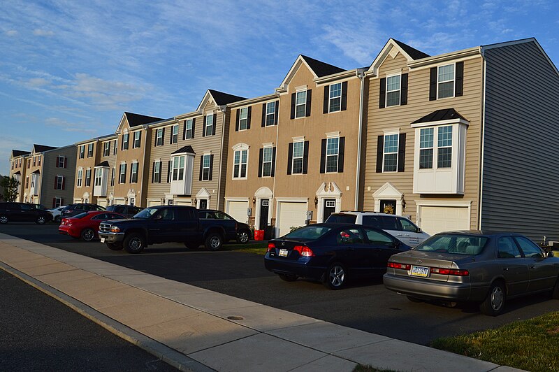 File:Townhouses with driveways as their front yards.jpg
