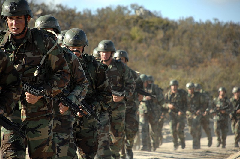 File:US Navy 071016-N-6552M-149 SEAL Qualification Training students endure a long hike after finishing their second day of close quarters combat instruction.jpg