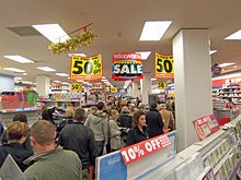 Crowded, disorganised, unpredictable environments are said to be high load. Woolworths Closing-down Sale, Grimsby - geograph.org.uk - 1076911.jpg
