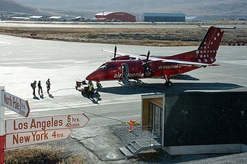 During the long daylight hours of the summer season, turnaround of passengers and freight is constant on these Dash 8 Q200 aircraft.