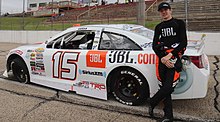 Eckes beside his 2019 ARCA car at Madison 15ChristianEckes2019ShoreLunch200.jpg