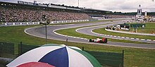 The pit entry (pictured at the 1988 German Grand Prix). Hamilton was on the pit entry (on the inside of the grass) and cut across the grass to rejoin the main track which was against the rules. 1988-GP-Deutschland.jpg