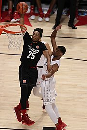 20170329 MCDAAG P. J. Washington dunks in front of Billy Preston.jpg