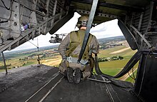 View out of MH-53M Pave Low IV in 2002, with its ramp open A US Air Force (USAF) AIRMAN assigned to the 21st Special Operations Squadron (SOS) mans the tail gunner position aboard a USAF MH-53M Pave Low IV helicopter, during a training flig - DPLA - 0f89cbff8775c4ef60ce2549bd22f334.jpeg