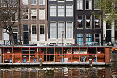 Street scene. Boathouse in an Amsterdam Channel. The Netherlands