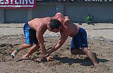 Anthony Gallton (left) vs Teet (right) at the 2010 USA World Team Trials Anthony Gallton (left) vs Robert Teet (right) during USA Wrestling's 2010 World Team Trials for beach wrestling.jpg