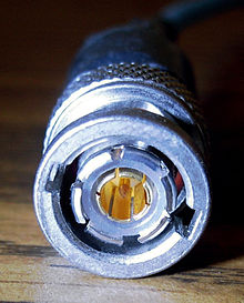 Triaxial BNC connector. Newer variants have three locking lugs rather than the two used here to prevent accidental interconnection with regular BNC connectors. BNC triax.jpg