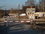 railway=level_crossing crossing:barrier=full crossing:light=yes crossing:saltire=yes