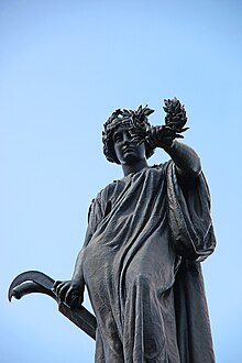 Figure representing "The South" atop the memorial. Confederate Monument - S at The South - Arlington National Cemetery - 2011.JPG