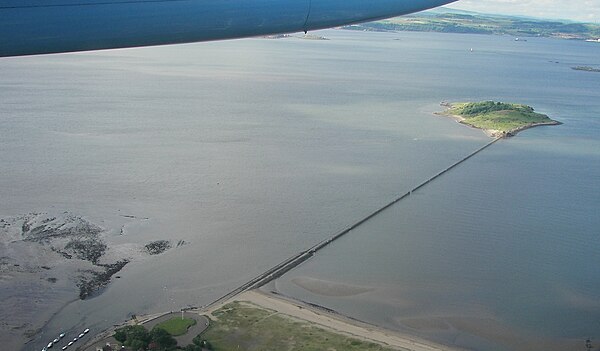 Cramond Island, Scotland, at high tide: the causeway is submerged, but the anti-boat pylons are still visible