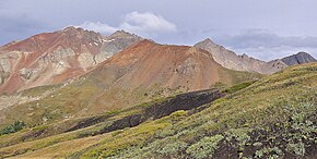 The reddish Cross Mountain centered, from southwest. (Mt. Wilson to the left) Cross Mountain, se.jpg