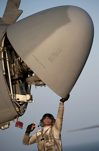 File:Defense.gov News Photo 110326-N-DR144-077 - Petty Officer 3rd Class Andre Estrada assigned to Electronic Attack Squadron 134 inspects the radar of an EA-6B Prowler aboard the flight deck of.jpg