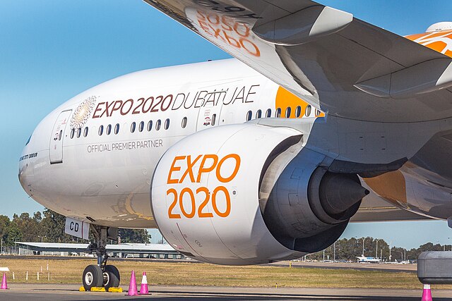 An Emirates Boeing 777-300ER (painted in the Expo 2020 orange livery) at Sydney Airport