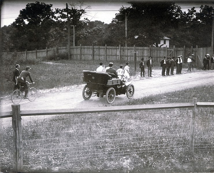 File:First runners leaving the stadium during the 1904 Olympic Marathon Race. (Mellor and Spring in front of referees' automobile).jpg