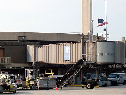 A July 2006 photograph of United Airlines Flight 93's departure gate, A17 (now demolished). Following the 9/11 attacks, American flags flew over the gates that the hijacked flights departed from.