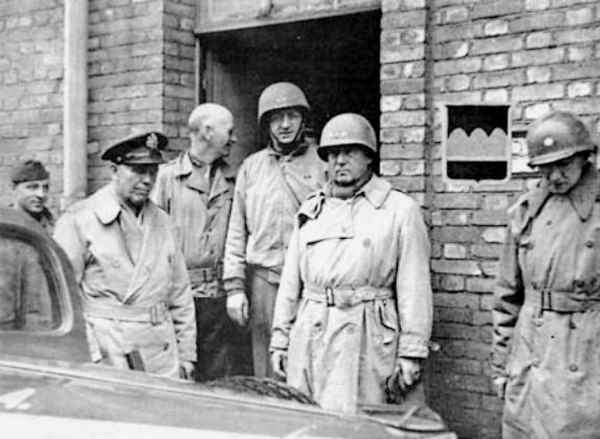 Shown from left to right are: an unidentified driver, General George C. Marshall, Major General Horace L. McBride, Major General Manton S. Eddy, Lieut