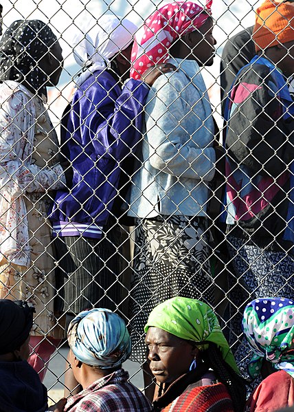 File:Haitian women stand in line to receive food distributed by the Irish non-governmentel organization GOAL in Kenscoff, Haiti, Feb. 20, 2010 100220-N-HX866-003.jpg