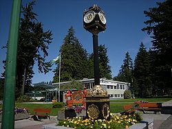 Municipal building and street clock with Memorial Park in background