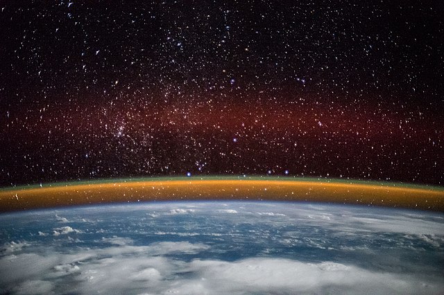 Yellow, green and red bands of airglow along Earth's limb as seen from space.