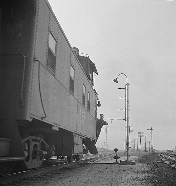 Picking up train orders on the ATSF in Isleta, New Mexico in 1943