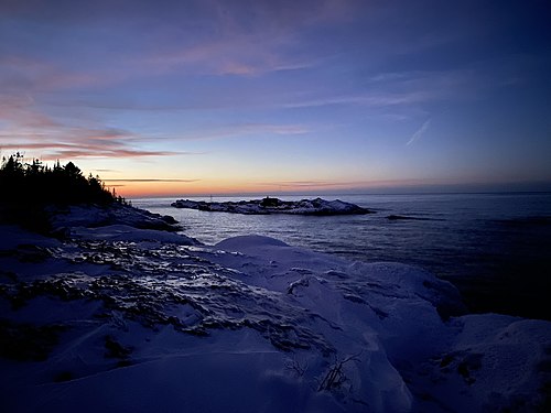 Island on the icy Lake Superior shore in Keweenaw County, Michigan, USA