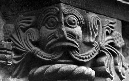 A sculpture of the mythical Green Man on the Church of St Mary and St David, Kilpeck