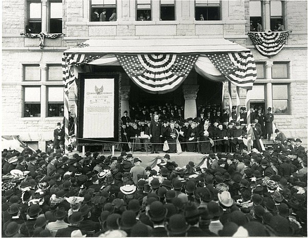 Knights of Columbus presented a check to Catholic University of America on the steps of the university's McMahon Hall in 1904 to establish a Chair of 